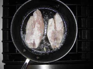 Tilapia searing in butter olive oil
